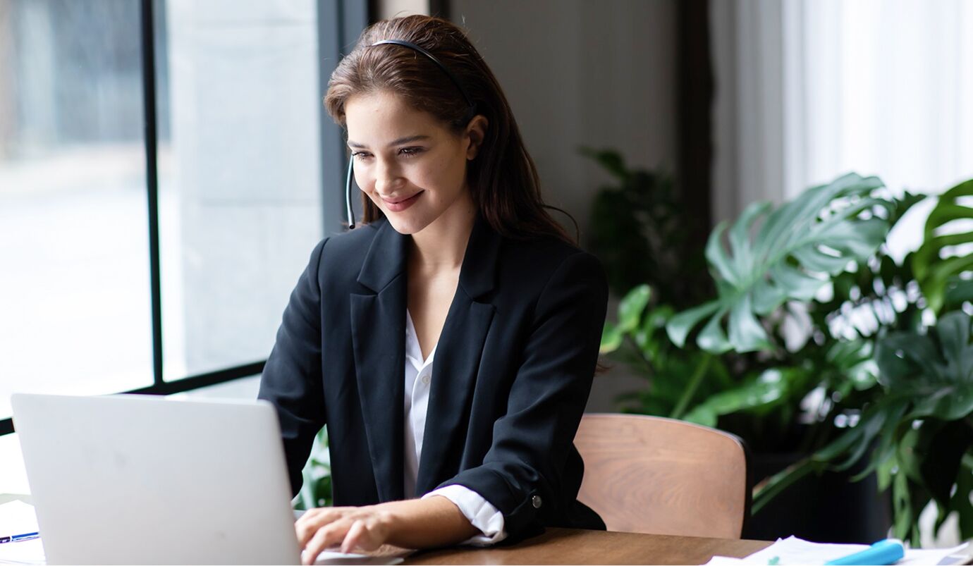young-businesswoman-checking-her-tablet-with-copy-space 1
